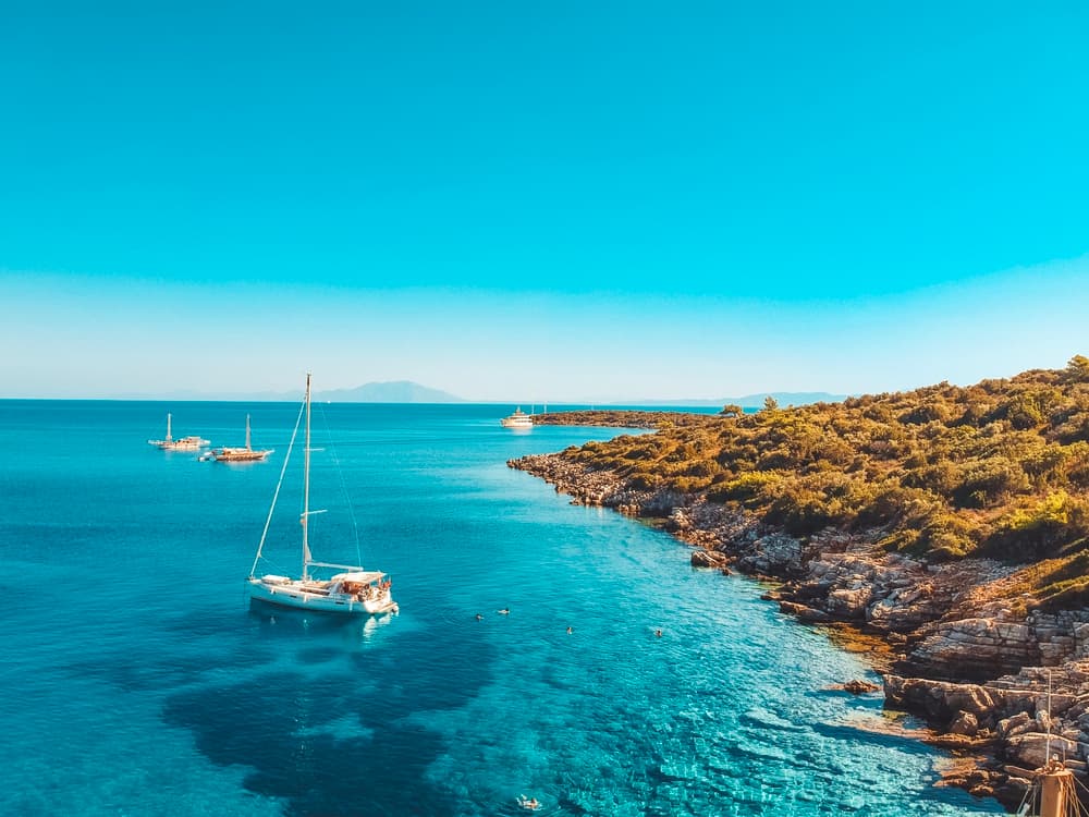 A traditional Turkish gulet boat anchored in the brilliant turquoise waters of Orak Island.
