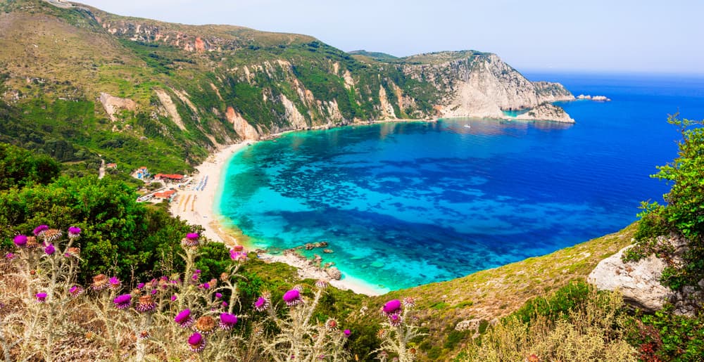 A spectacular sunset over the wild, dramatic landscape of Petani Beach, Kefalonia.