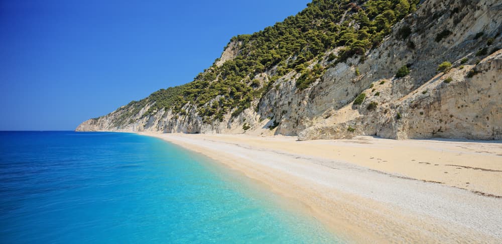 The vast, wild stretch of Egremni Beach with its incredible turquoise water, seen from the cliffs above.