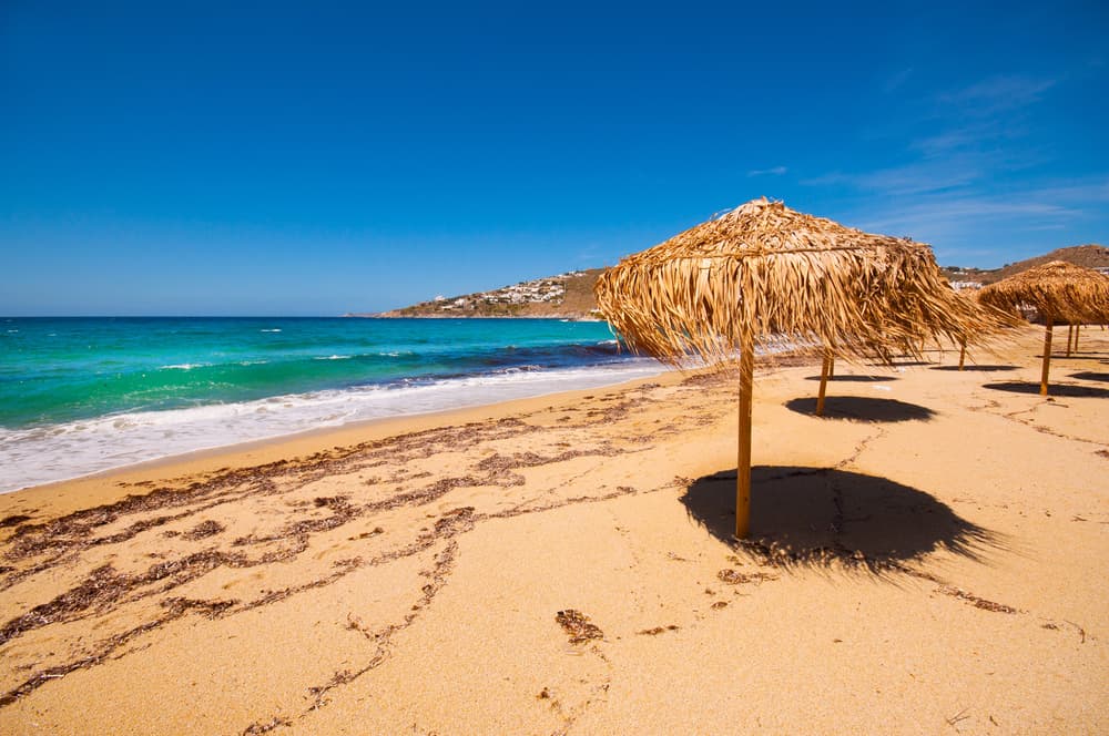The organized, sandy shore and clear waters of Platis Gialos Beach, Mykonos.