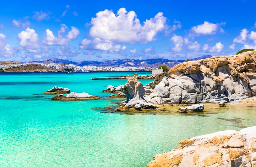 The unique, smooth granite rock formations creating small coves at Kolymbithres Beach, Paros.
