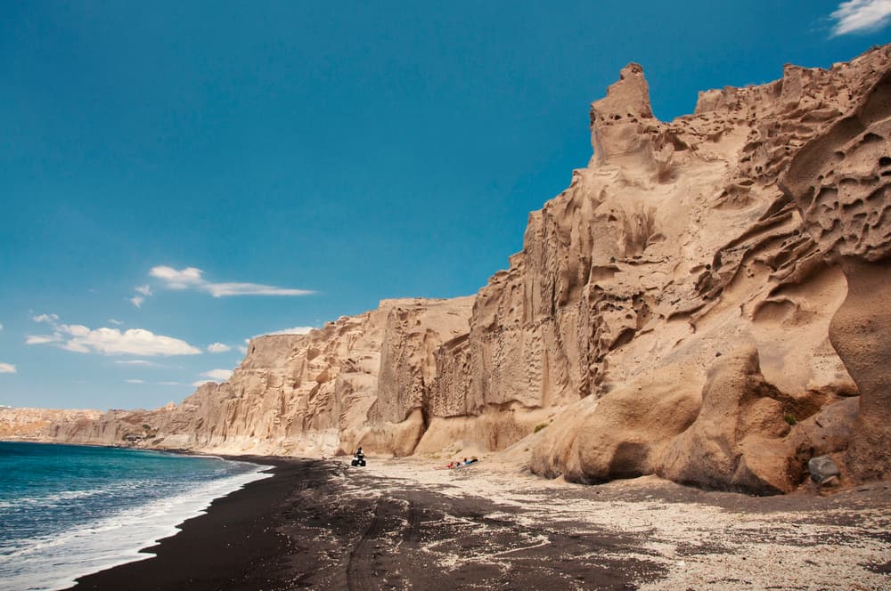 The incredible lunar-like, wind-carved cliffs of Vlychada Beach, Santorini.