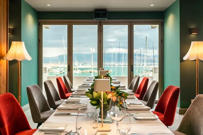 Dining by the water at Varoulko Seaside with a view of the picturesque Mikrolimano marina.