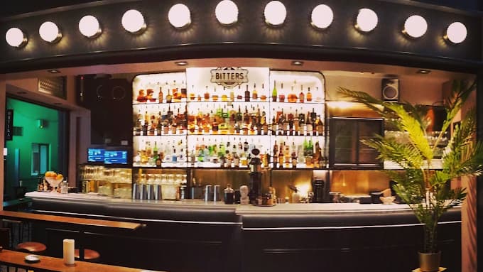 A classic, expertly crafted cocktail in the speakeasy-style atmosphere of The Bitters Bar.