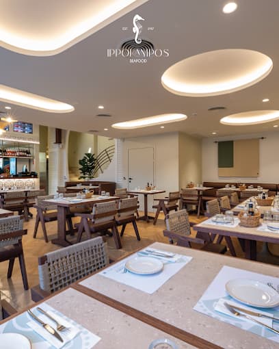 Seaside dining at Ippokambos with a view of the Koules Fortress in Heraklion's Venetian harbor.