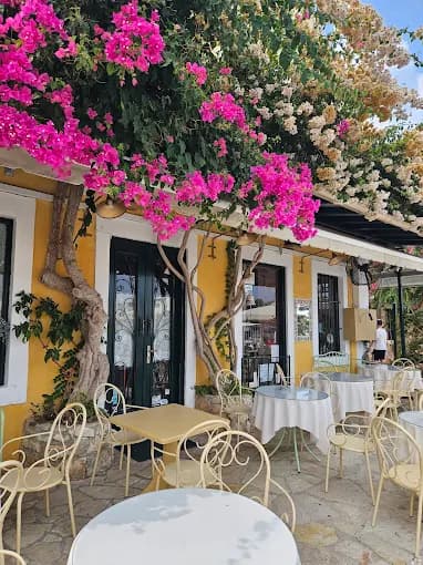 Elegant waterfront dining at the legendary Tassia Restaurant in the port of Fiskardo.