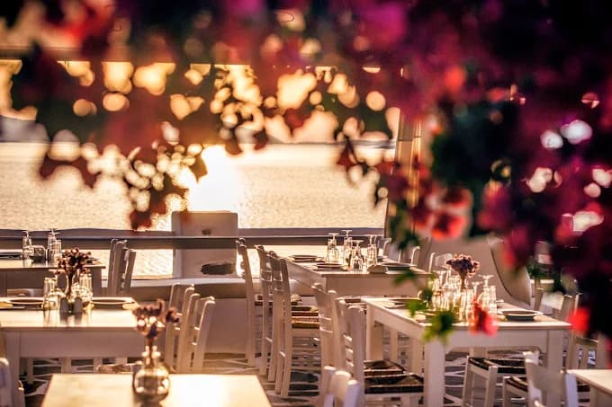 A beautifully plated modern seafood dish at Siparos with a stunning view of the sea.